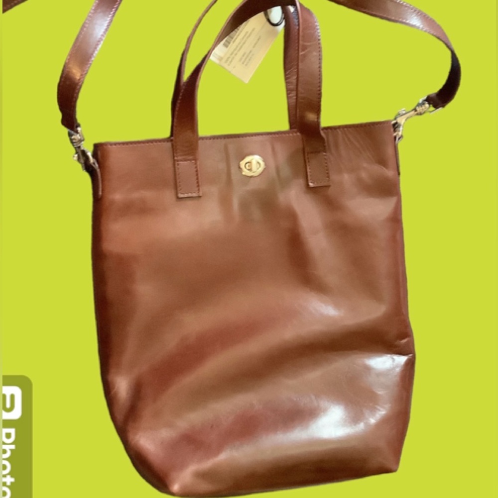 Large Day Bag w/detachable shoulder strap that also adjust. Large pockets NWT